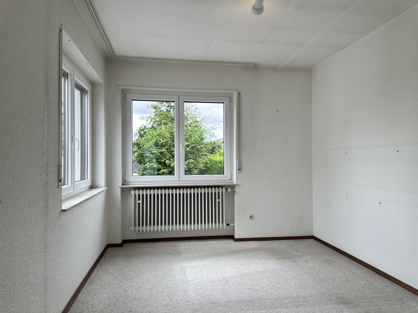 Wohnen mit Wohlfühlcharakter - Doppelhaushälfte mit Garten und Garage in beliebter Wohnlage